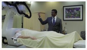 Neurosurgeon giving tour of operating room