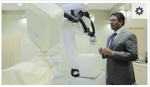 Neurosurgeon showing technology in operating room